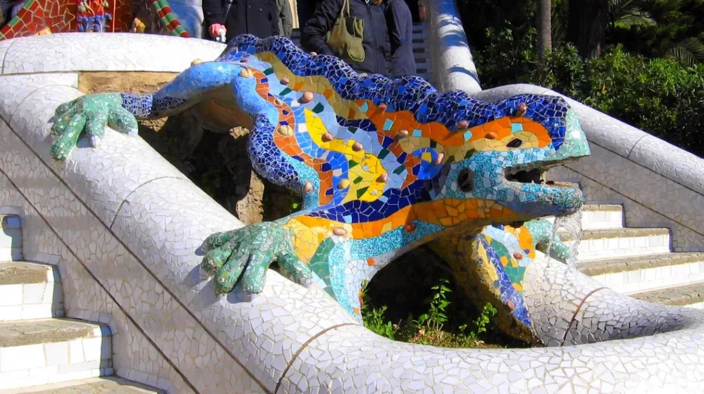 Colorful mosaic covered salamander design fontain "Dragon" which is a favorite symbol of the park in Parc Güell.